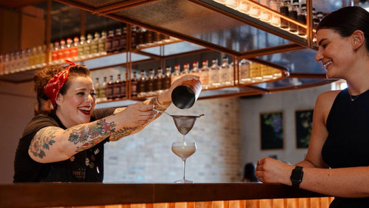 Lizzie from Four Pillars Gin pouring a gin cocktail at the Healesville distillery bar.