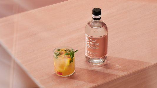 My New Go-To Gin next to a fruity gin cocktail