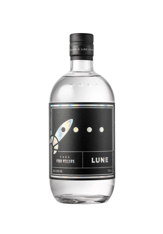 A bottle of Croissant Gin with a label featuring a rocket and the name LUNE, indicating a silky gin collaboration with Lune Croissanterie.