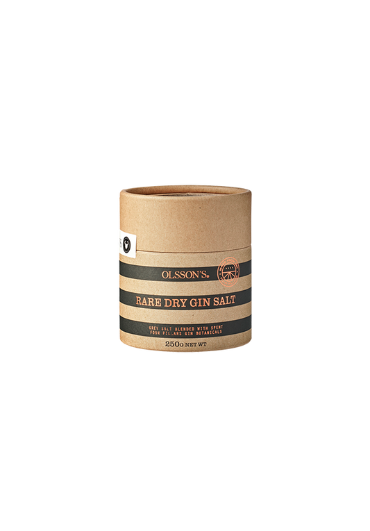 A cylindrical container labeled 'RARE DRY GIN SALT' from Olmon's, indicating a product made from dried and crushed botanicals from Rare Dry Gin combined with natural grey salt.