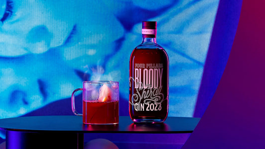 Limited Edition Bloody shiraz 2023 bottle label next to a steaming hot toddy gin cocktail. 