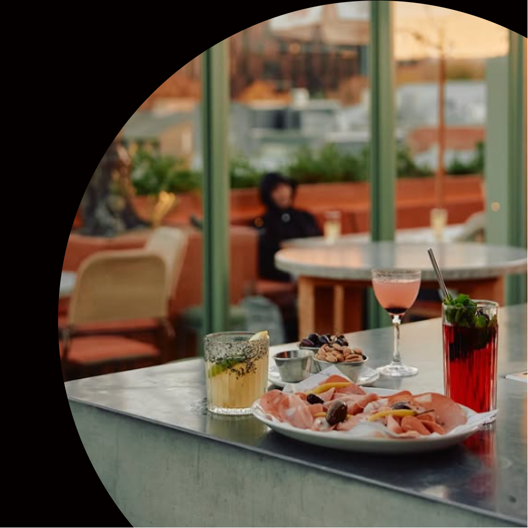 Promotional graphic for Johnny's Green Room in Melbourne with a rooftop view and drinks.