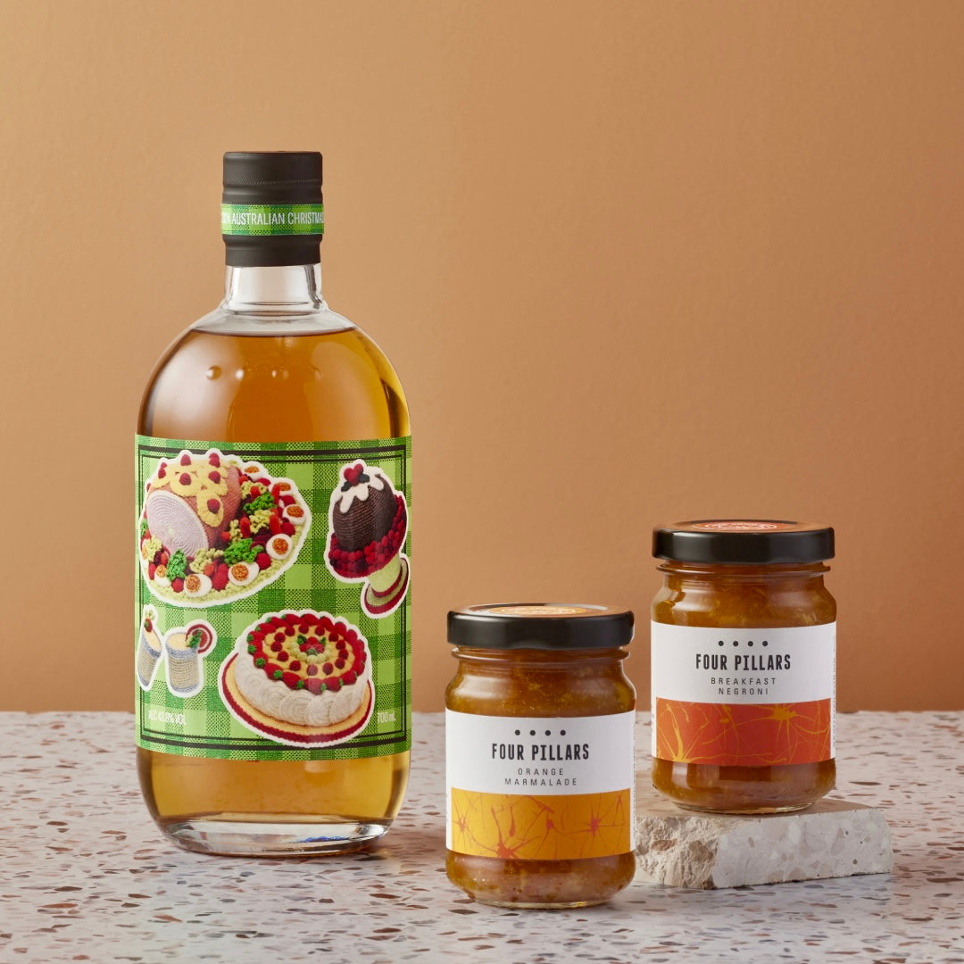 A Four Pillars Gin corporate gifting bundle of Australian Christmas Gin and two made-from-gin marmalades, Breakfast Negroni and orange flavour. 