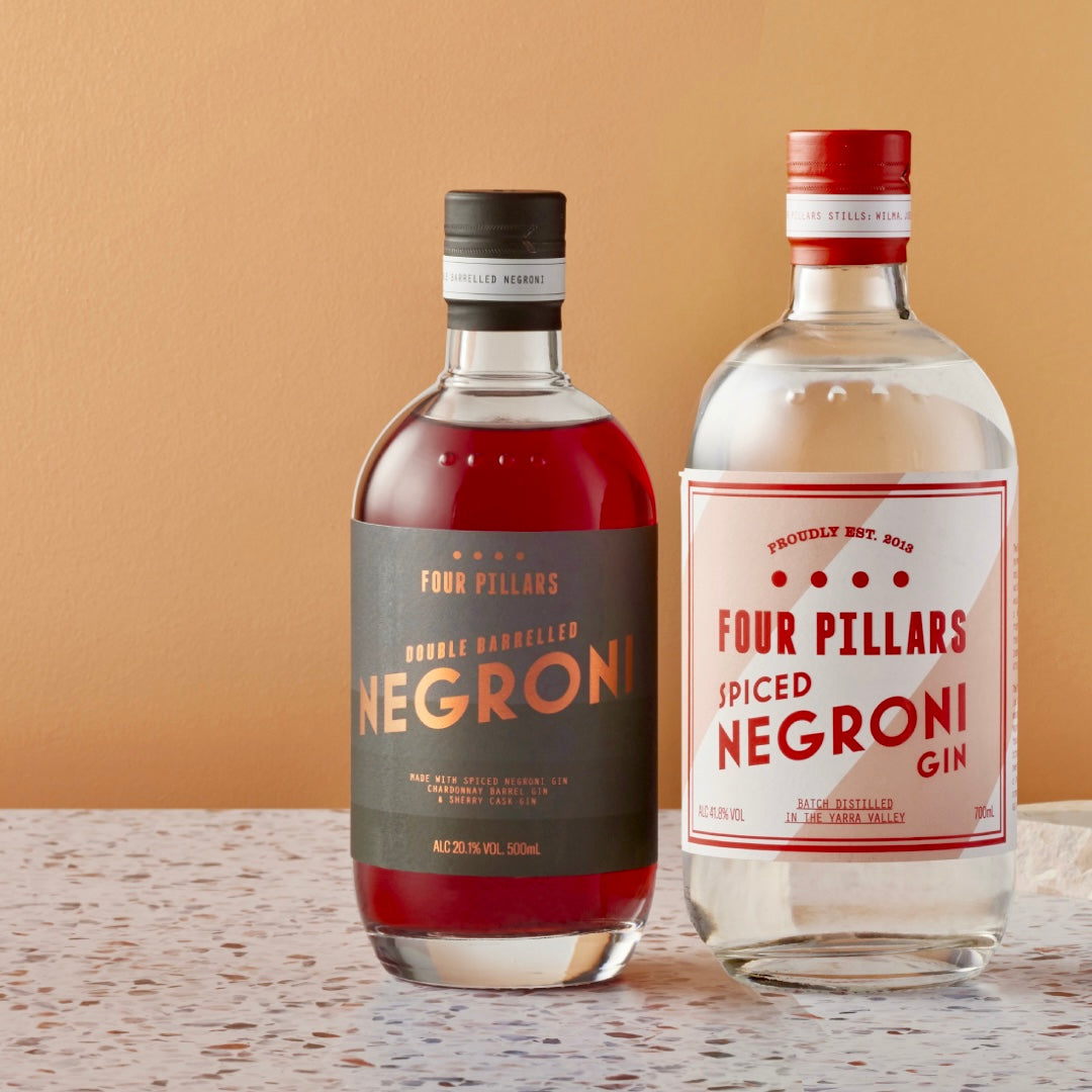 A Four Pillars Gin corporate gifting bundle made up of Spiced Negroni Gin and a bottled cocktail of Double Barrelled Negroni. 