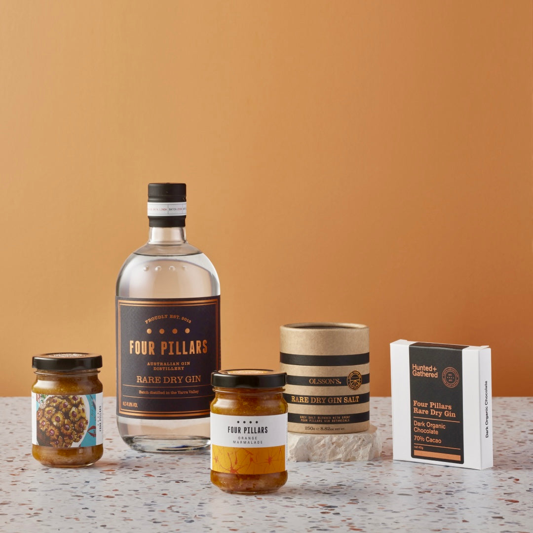 A Four Pillars Gin corporate gifting bundle made up of Rare Dry Gin and a range of made-from-gin goodies like Ham Glaze, Orange Marmalade, Rare Dry Gin Salt, and Rare Dry Gin Chocolate. A sustainable and tasty arrange of treats perfect for gifting. 