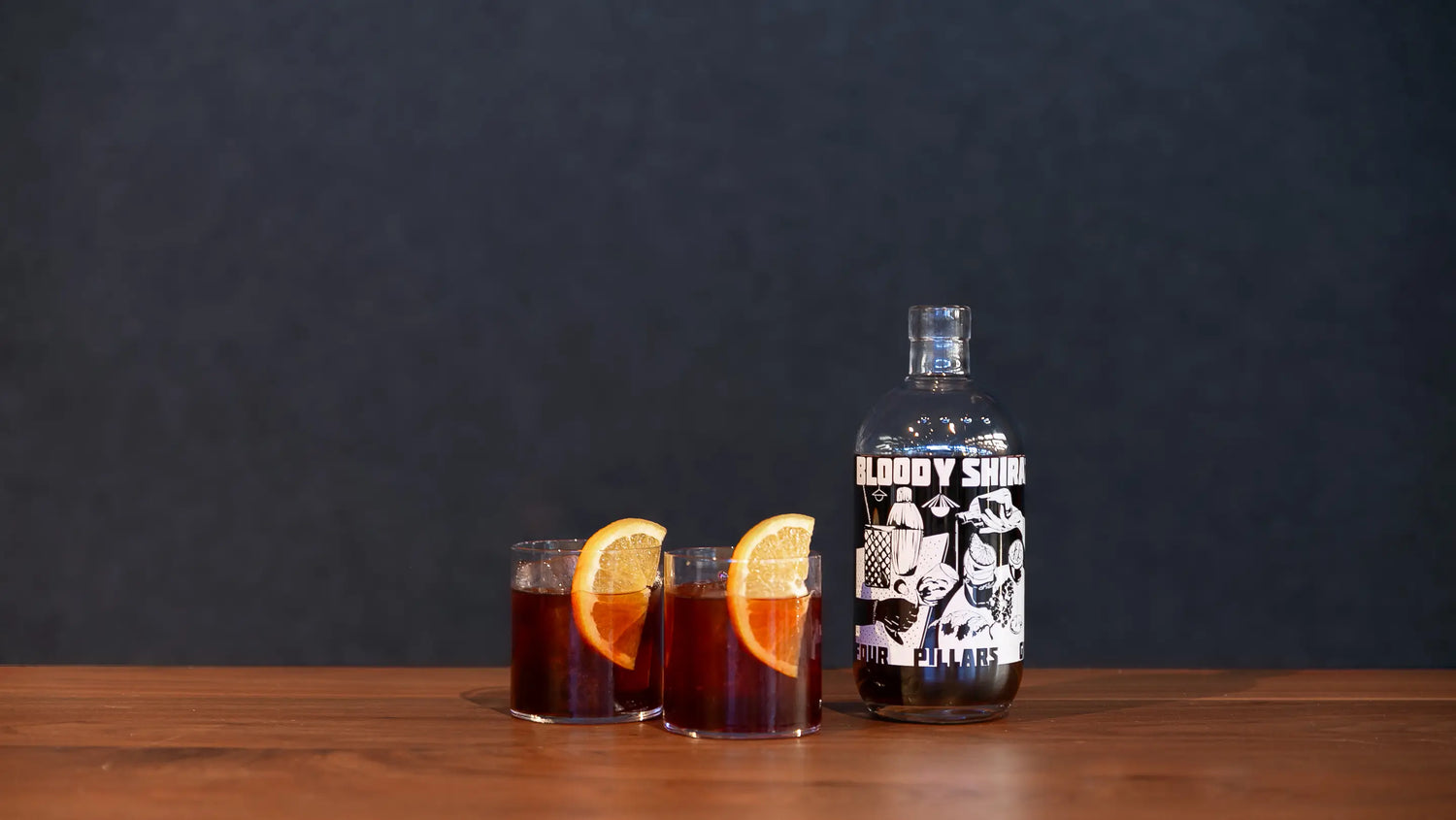 A Limited Edition 2024 Bloody Shiraz Gin from Four Pillars gin besides two cafe negroni cocktails - a perfect cocktail for sharing.