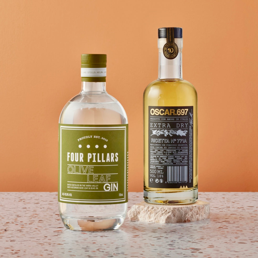 A Four Pillars Gin corporate gifting bundle made up of Olive Leaf Gin and a bottle of Oscar 697 Extra Dry, the perfect gift for anyone looking to make a fancy martini at home. 